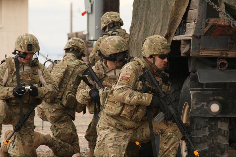 A Soldier (left) from the Future Combat Systems, Evaluation Brigade Combat Team, views his screen for unforeseen obstacles during an exercise and live demonstration.